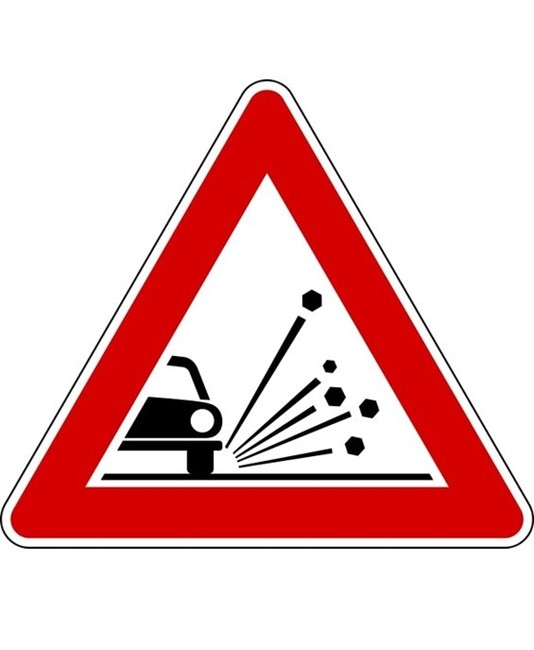 Cartello stradale materiale instabile sulla strada Cartello stradale materiale instabile sulla strada