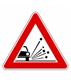 Cartello stradale materiale instabile sulla strada