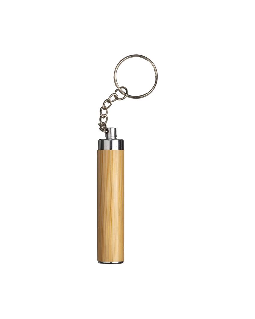 Torcia  LED in bamboo con anello portachiavi, 3 batterie LR41 incluse